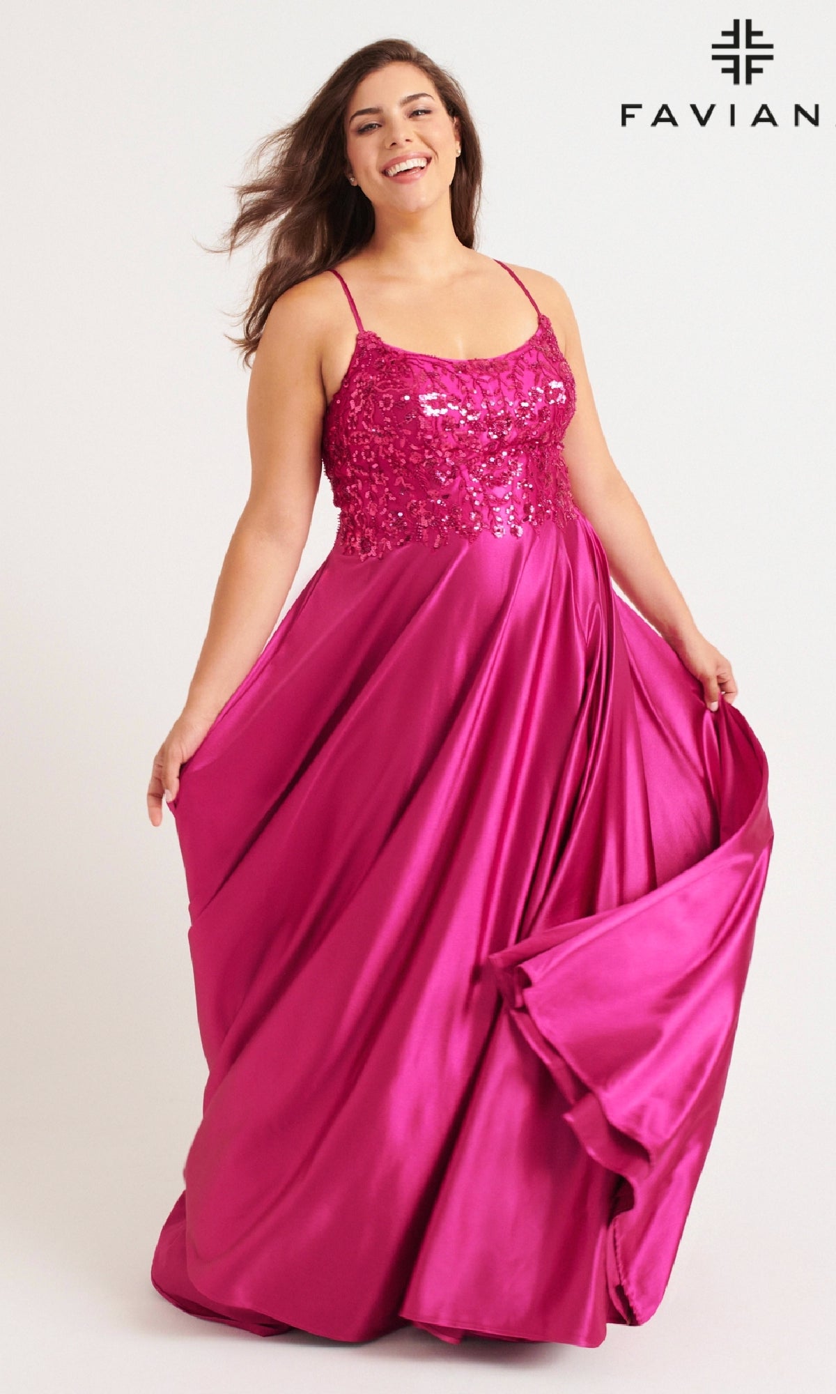 A woman wears the Faviana 9582 Long Plus-Size Prom Dress, a magenta sequin-embellished gown with spaghetti straps and beaded bodice, holding out the skirt. The Faviana logo is in the top right corner.